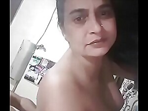 Punjabi cutie gets her ass pounded by a big black cock, moaning in pleasure as she's roughly taken doggie style.