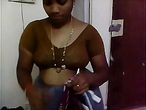 Srilatha Reddy, an Indian housewife, gets naughty with a delivery guy.